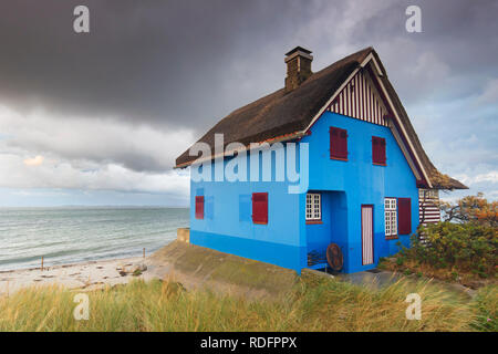 Blue beach house on the peninsula Graswarder, Heiligenhafen, Schleswig-Holstein, Germany Stock Photo