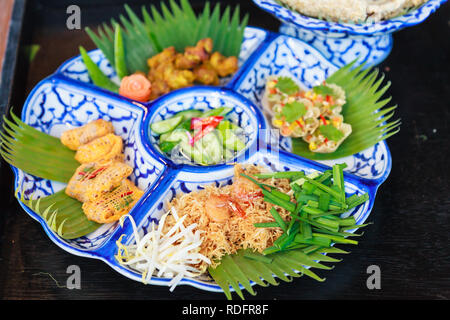 Selective focused on Thailand street food: Mi krop, Traditional Thai Crispy Noodles Dish made with rice noodles and sweet flavored sauce, served on ba Stock Photo