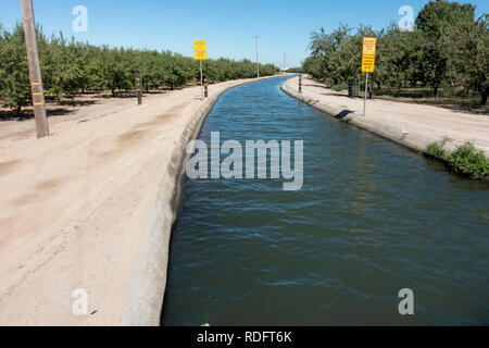 Agricultural aqueduct for irrigation on California central valley farm land - California, USA Stock Photo