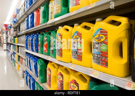 Motor oil bottles on shelves at Walmart store - USA Stock Photo