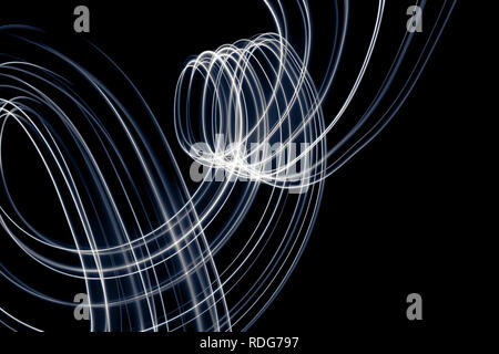 Abstract light lines on black background. Light painting photography. Abstract design with lights in the dark. Stock Photo