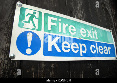 Fire Exit and Keep Clear Sign, Portsmouth, UK. Stock Photo
