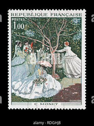 Postage stamp from France depicting the Claude Monet painting 'Woman in Garden' Stock Photo