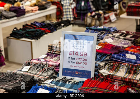 Ballentrae and Edinburgh lambswool scottish scarves on sale inside a shop in Edinburgh,Scotland,UK Stock Photo