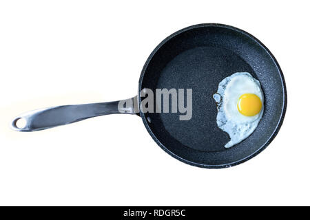 Fried egg in non-stick cooking pan isolated on white background. Stock Photo