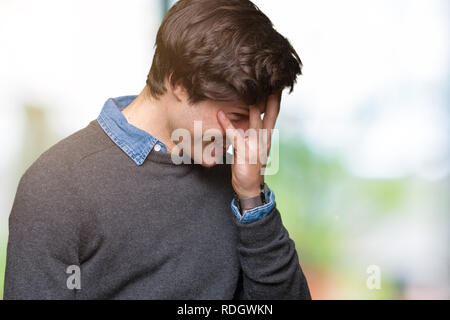 Young handsome elegant man over isolated background with sad expression covering face with hands while crying. Depression concept. Stock Photo