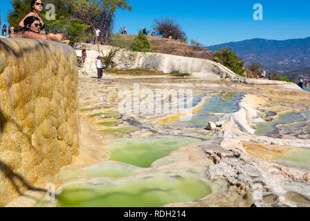 A landscape view of Hierve el Agua with tourists, Petrified waterfall, Oaxaca, Mexico Stock Photo