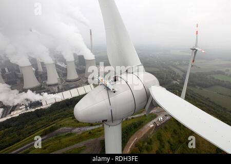 Wind energy plant on a spoil tip, EON Scholven coal-fired power station at the back, Gelsenkirchen, North Rhine-Westphalia Stock Photo