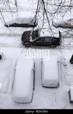 Snow-covered cars in a residential street, Essen, North Rhine-Westphalia