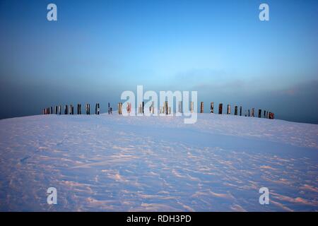 Landmark art installation, Totems, created from railway sleepers by the Basque painter and sculptor Agustín Ibarrola, in winter Stock Photo