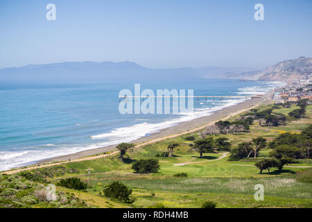 Aerial view of Pacifica Municipal Pier and Sharp Park golf course as seen from the top of Mori Point, Marin County in the background, California Stock Photo