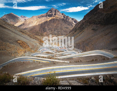 Serpentine road at Andes Mountain between Santiago de Chile and Mendoza, Argentina Stock Photo
