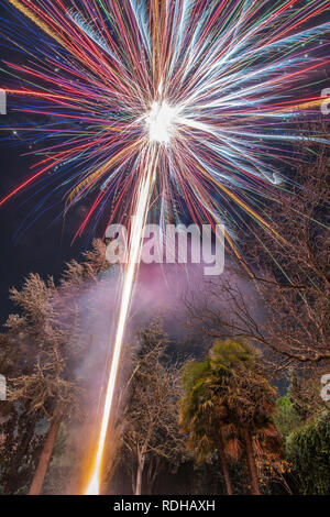 An amazing fireworks show during New Year's Eve celebration for the beginning of a happy new year on a nice Christmas in Spain at Madrid city Stock Photo