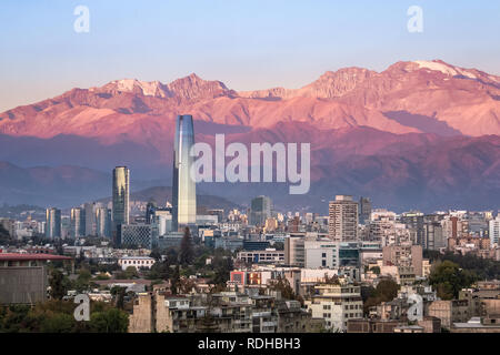 Aaerial view of Santiago skyline at sunset with Costanera skyscraper and Andes Mountains - Santiago, Chile Stock Photo