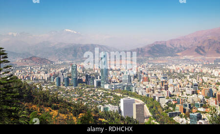 Aaerial view of Santiago skyline at sunset with Costanera skyscraper and Andes Mountains - Santiago, Chile Stock Photo