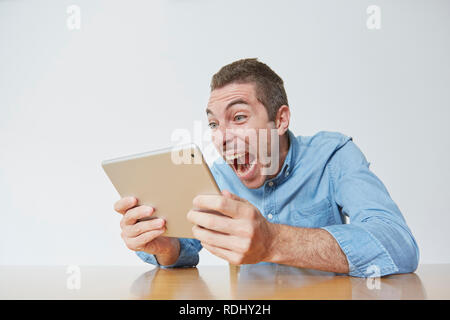 Caucasian man using tablet Stock Photo