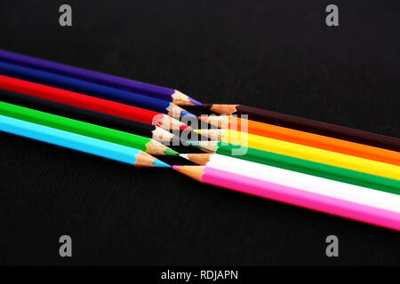 Beautiful colored pencils. Isolated on the Black background. Stock Photo
