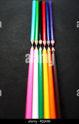Photo of beautiful colored pencils. Isolated on the Black background. Stock Photo