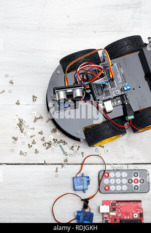 robot and different necessary parts to build a robot. Vertical Photo Stock Photo