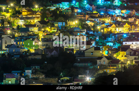 Night scene in the valley with bright houses with colorful lights makes the night scene in the countryside more vibrant in the Da Lat plateau, Vietnam Stock Photo