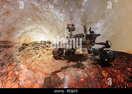 Curiosity Mars Rover exploring the surface planet of Mars. Elements of this image furnished by NASA. Stock Photo
