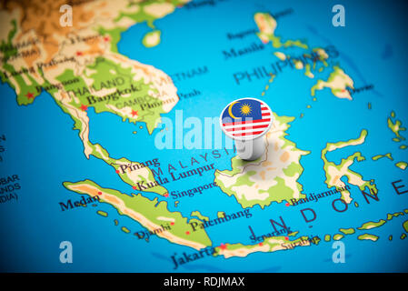 Malaysia marked with a flag on the map Stock Photo