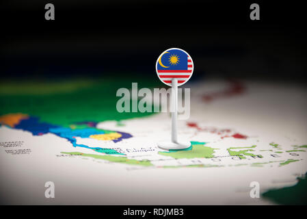 Malaysia marked with a flag on the map Stock Photo