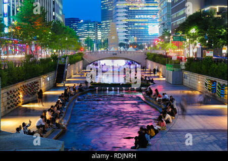 Colorful city lights of Cheonggyecheon Stream Park with Crowd at night in Seoul City, South Korea. Stock Photo