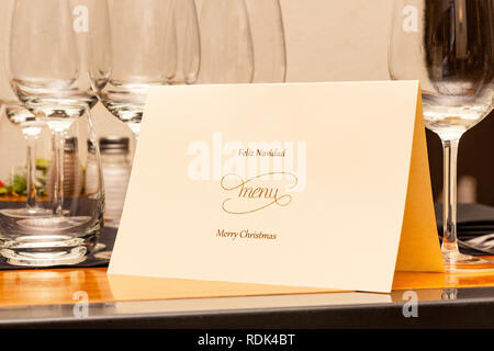 Christmas Menu laid on the table before dinner. Stock Photo