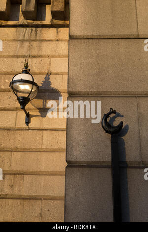 Lamp and fish-theme architecture on Fishmongers Hall Wharf beneath London Bridge in the City of London - aka the Square Mile - the capital's financial district, on 17th January 2019, in London, England. Stock Photo