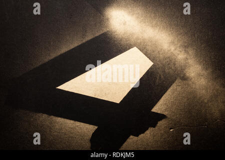 Golden abstract composition on black surface made with spray. Stock Photo
