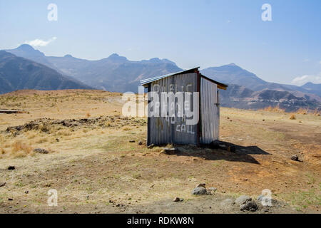 A unique phone booth made of corrugated sheet metal looks out of place in a remote area along Monantsa Pass in Butha-Buthe district of Lesotho. Stock Photo