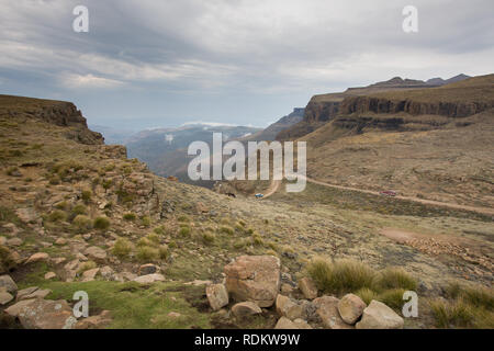 Sani Pass is a famous 4x4 dirt road that conects KwaZulu-Natal in South Africa to Thaba-Tseka in Lesotho. South Arican border control is at the bottom. Stock Photo