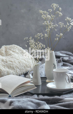 Still life composition with a cup of coffee and a book Stock Photo