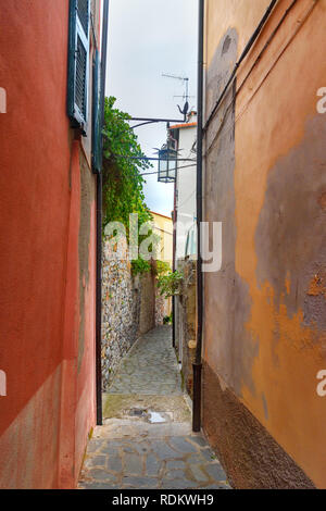 Old narrow street in Portovenere or Porto Venere town on Ligurian coast. Province of La Spezia. Italy Stock Photo