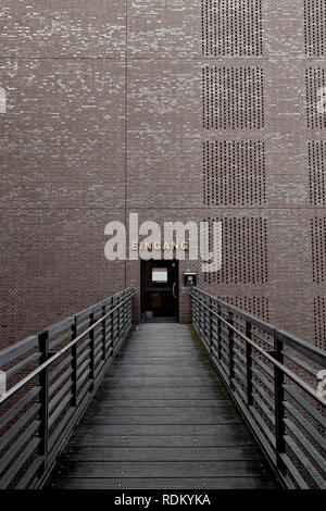 Bridge to a Brick wall with a door to open Stock Photo