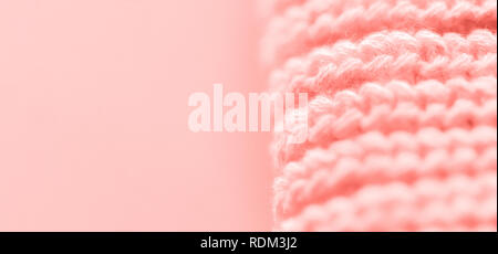 close up of knitted fabric in living coral color Stock Photo