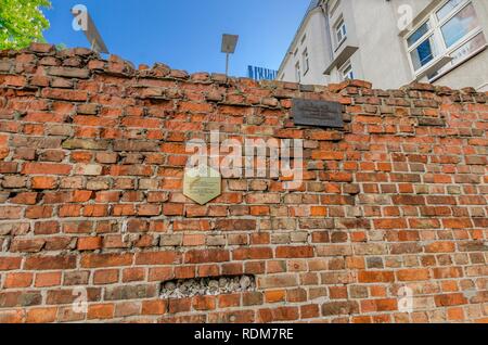 WARSAW, MASOVIA PROVINCE / POLAND - MAY 5, 2018: Remains of the ghetto wall in the center of Warsaw. Stock Photo