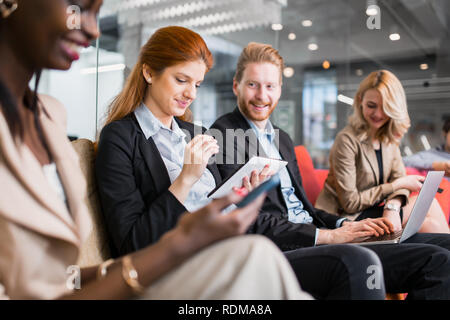 Business people collaborating in office and working on project together Stock Photo
