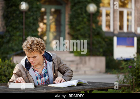 Young man study outdoors Stock Photo