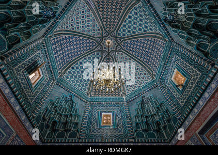 Interior, mosaic patterns in a dome of a Madrasa building in Samarkand. Stock Photo
