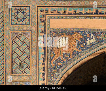 A tiger pattern in glazed tiles on the Sher-Dor Madrasah iwan archway in Registan square. Stock Photo