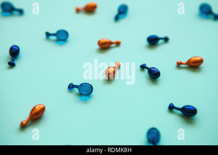 Many pills or capsules with hyaluronic acid and q10 or coenzyme. Caring for skin health. Stock Photo