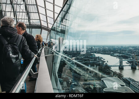 London, UK - January 13, 2019: People standing on an open air observation balcony in Sky Garden, London. Sky Garden, the highest public garden in Lond Stock Photo