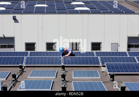 Construction of a large photovoltaic system on several rooftops, 16000 square metres, Gelsenkirchen, North Rhine-Westphalia Stock Photo