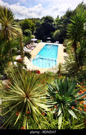 Swimming pool, holiday cottages, Mille Fleurs Garden, garden landscape, St. Peter's, Guernsey, Channel Islands, Europe Stock Photo