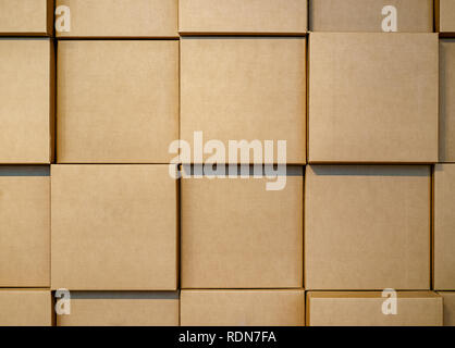 Cardboard blank boxes wall. Background Stock Photo