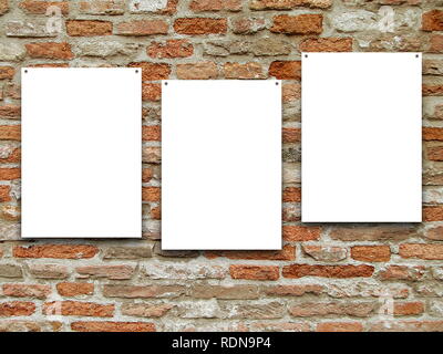 Three blank frames on brown weathered brick wall background Stock Photo