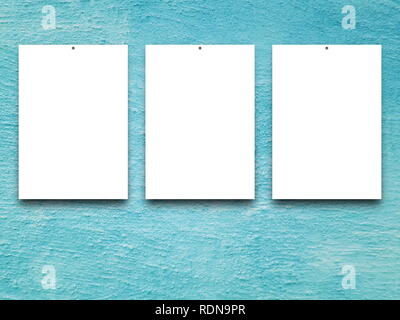 Three blank frames on aqua concrete wall background Stock Photo