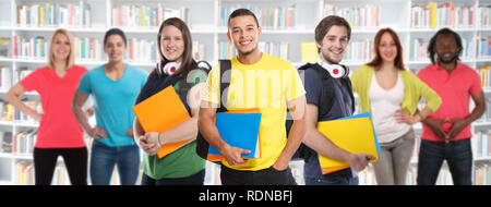 Group of students college student young people studies library learning banner education smiling happy learn Stock Photo